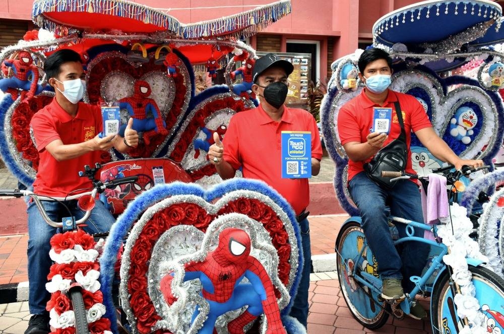 在甲州旅游局帮助下，马六甲80%的三轮车夫注册成为TnGo电子钱包用户。-马新社-