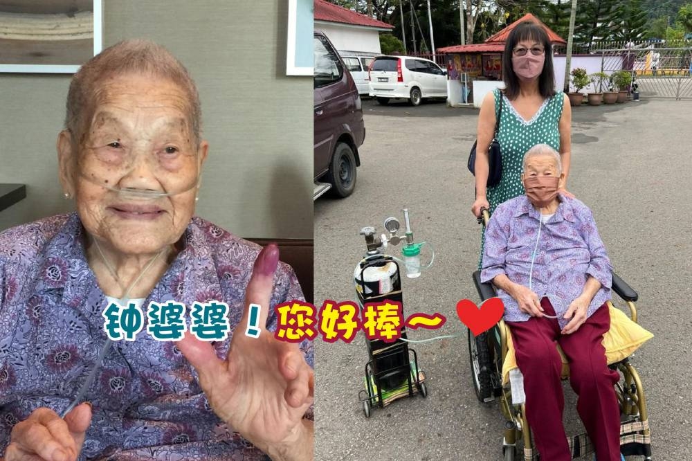 来自沙巴的102岁选民钟贵珍婆婆，由亲人推着轮椅带着氧气筒，亲自到投票中心投票。-摘自网络，精彩大马制图-
