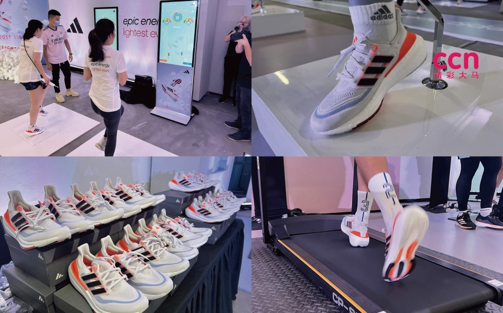 不少参与者纷纷试穿新款ULTRABOOST LIGHT跑鞋,体验该鞋款缓震、舒适、轻盈的效果。-庄礼文摄-