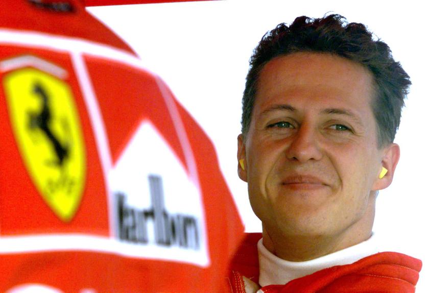 Germany's Michael Schumacher smiles in the pit area after completing his second qualifying session of the Hungarian Formula One Grand Prix in this August 15, 1998 file photo. u00e2u20acu201d Reuters pic