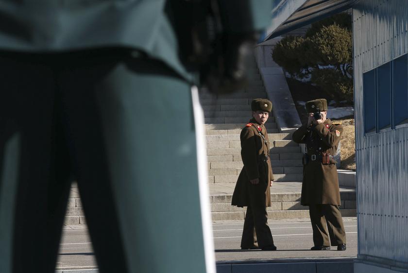 A North Korean soldier takes photographs of a South Korean soldier standing guard at the truce village of Panmunjom in the demilitarised zone (DMZ) separating North Korea from South Korea, about 55 km (34 miles) north of Seoul January 29, 2014. u00e2u20acu201d Reuter
