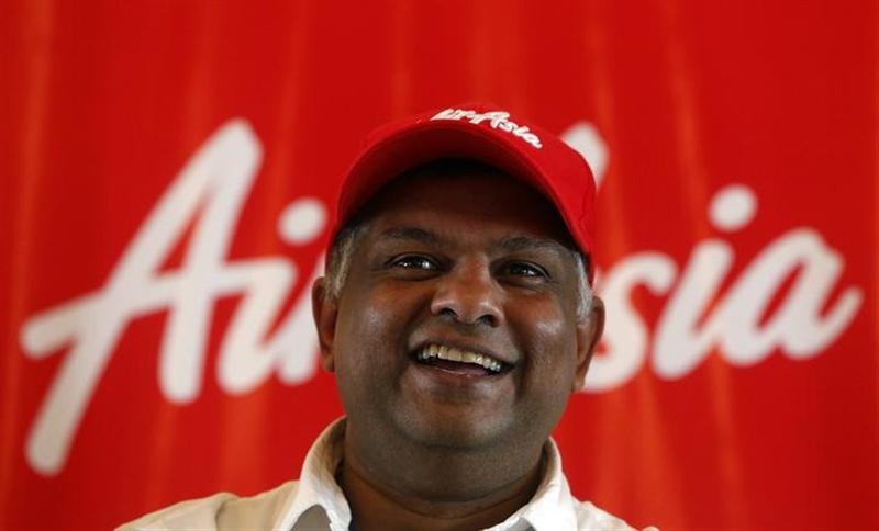 AirAsia Group CEO Tony Fernandes smiles during a news conference in Mumbai July 1, 2013. u00e2u20acu201d Reuters pic