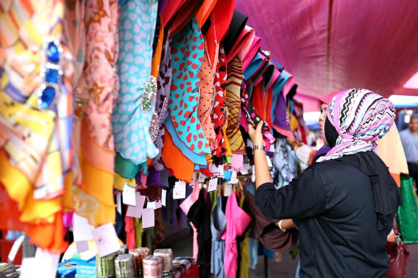People buy new cloth, scarf, and food for Hari Raya at Pasar Tani Kuala Besut, July 16, 2013. u00e2u20acu201d Picture by Saw Siow Feng