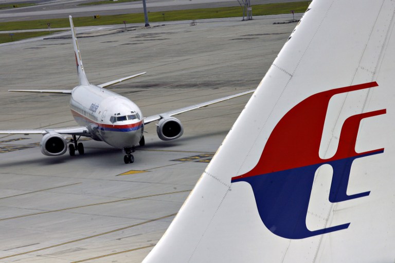 A Malaysia Airlines Boeing 737 aircraft (left) taxis on the tarmac of the Kuala Lumpur International Airport in Sepang. u00e2u20acu201d AFP pic