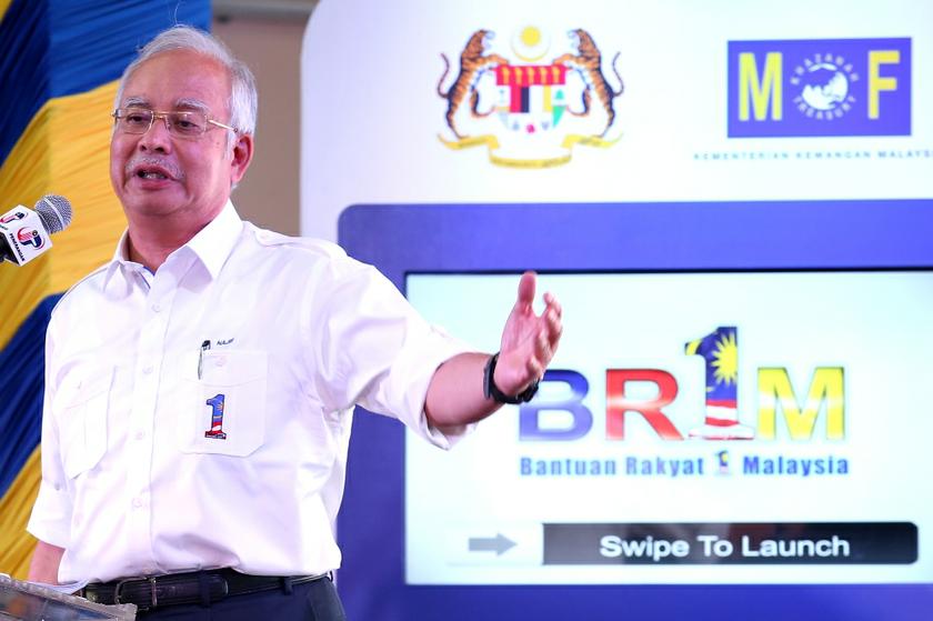 Prime Minister Datuk Seri Najib Tun Razak launches the national-level 1Malaysia People's Aid (BR1M) 2014 at SMK Aminuddin Baki, Kampung Pandan, Kuala Lumpur February 22, 2014. u00e2u20acu201d Picture by Saw Siow Feng