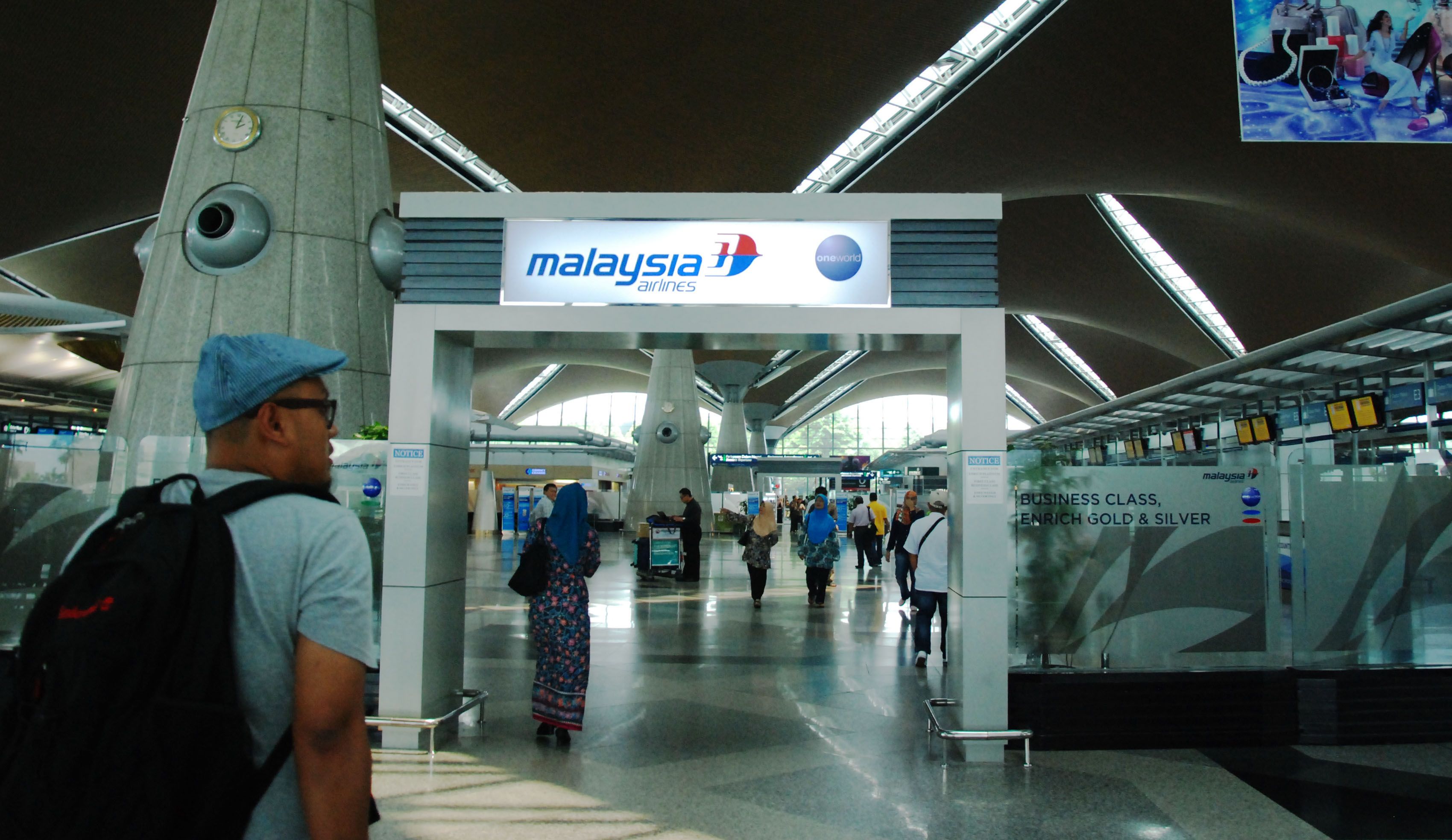 A passenger walking towards the check-in counters at the Kuala Lumpur International Airport (KLIA) in Sepang, March 9, 2014. u00e2u20acu201d Picture by Mohd Yusof Mat Isa