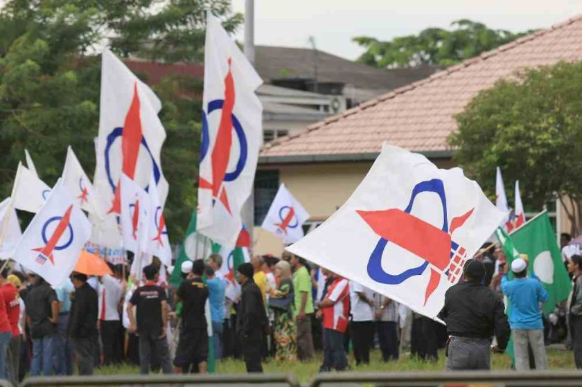 DAP flags seen on nomination day in Teluk Intan, May 19, 2014. u00e2u20acu201d Picture by Saw Siow Feng