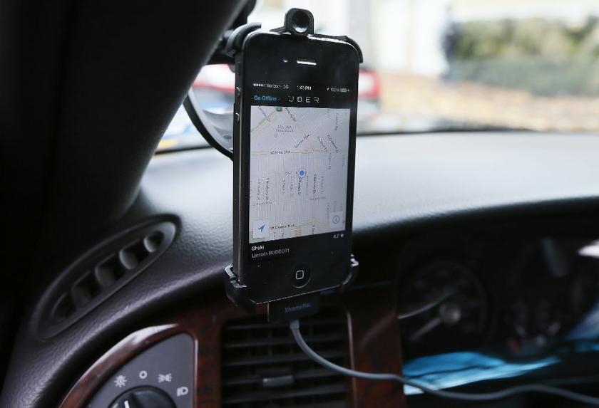 Transportation app Uber seen on the iPhone of limousine driver Shuki Zanna, 49, in Beverly Hills, California, December 19, 2013 Reuters