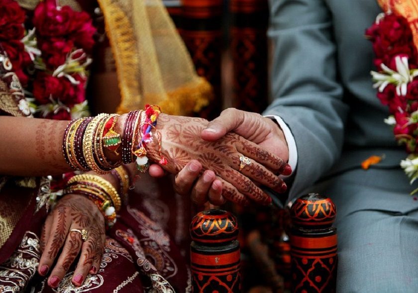 An unidentified Indian visually impaired couple hold hands during a mass marriage of people of Andh Kanya Parakash Gruh in Ahmedabad, 22 January 2008. u00e2u20acu201d AFP pic