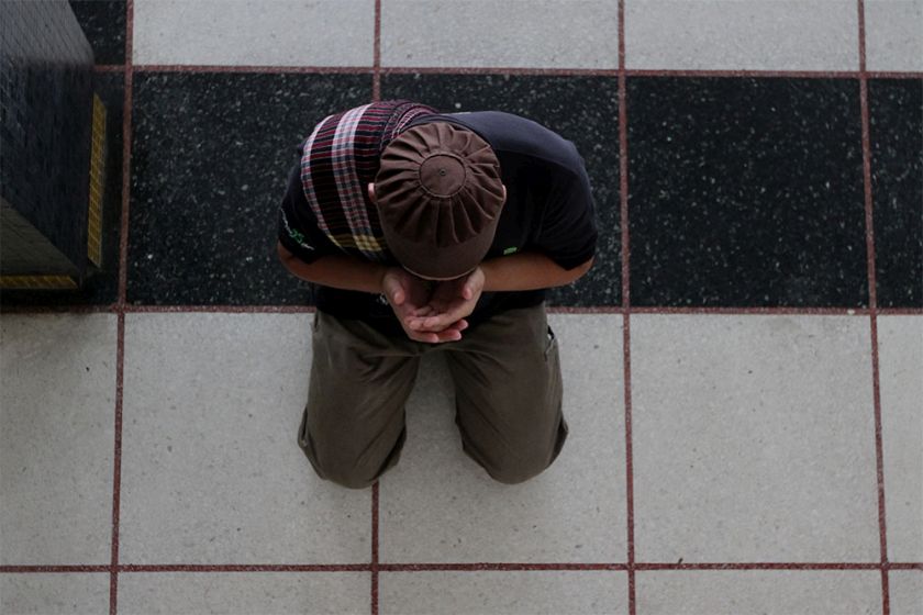 A man is seen reciting the doa after perform Friday prayers at the National Mosque in Kuala Lumpur, July 4, 2014. u00e2u20acu201d Picture by Yusof Mat Isa