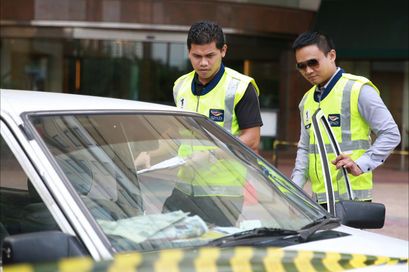 Land Public Transport Commission (SPAD) officials conduct a check on taxi drivers in Kuala Lumpur, on July 14, 2014. u00e2u20acu201d Picture by Saw Siow Feng