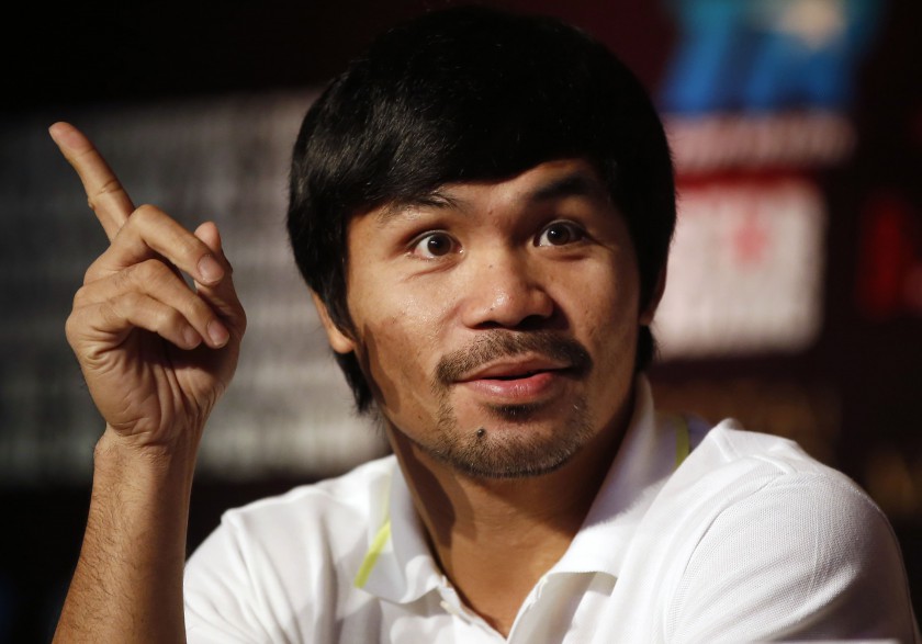 File picture shows Manny Pacquiao attending a promotional event at a hotel in Shanghai August 26, 2014. 