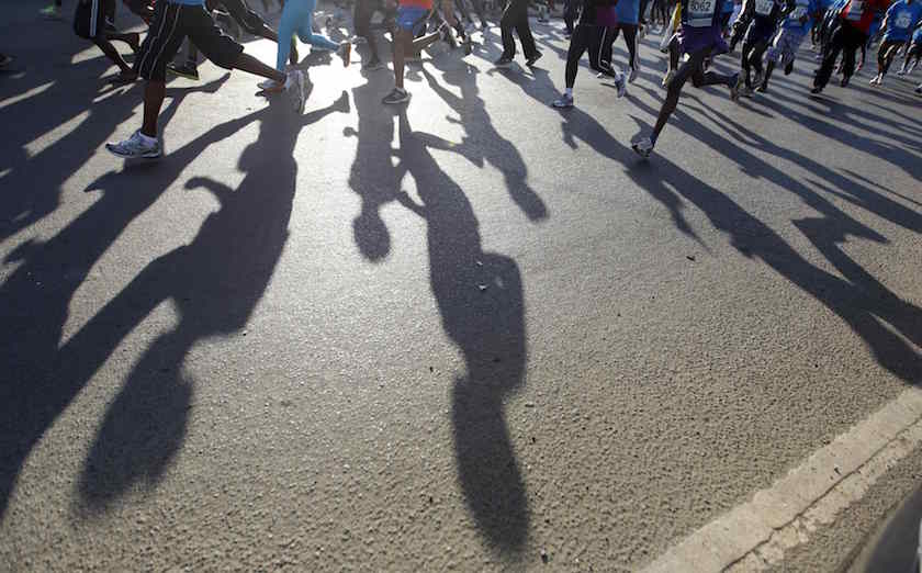 Runners cast shadows on the ground as they take part in the Standard Chartered Nairobi Marathon in Nairobi October 26, 2014. u00e2u20acu201d Reuters pic