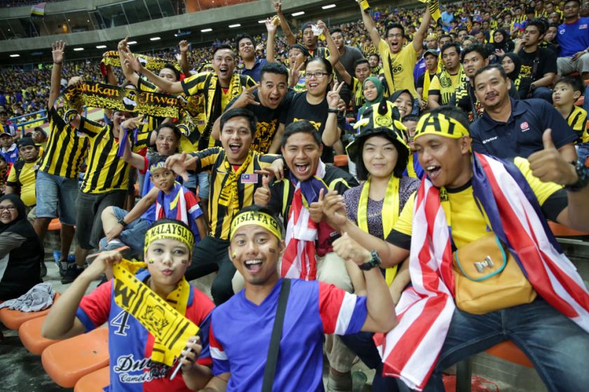 Malaysian fans cheer as Malaysia face Vietnam in the AFF Suzuki Cup 2014 semi-final first leg match at the Shah Alam Stadium, December 7, 2014. u00e2u20acu201d Picture by Choo Choy May