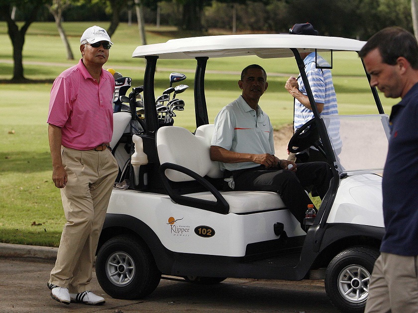 US President Barack Obama and Prime Minister Datuk Seri Najib Tun Razak get in their golf cart after playing on the 18th green at the Clipper Golf course on Marine Corps Base Hawaii during Obamau00e2u20acu2122s Christmas holiday vacation in Kaneohe, Hawaii, December 