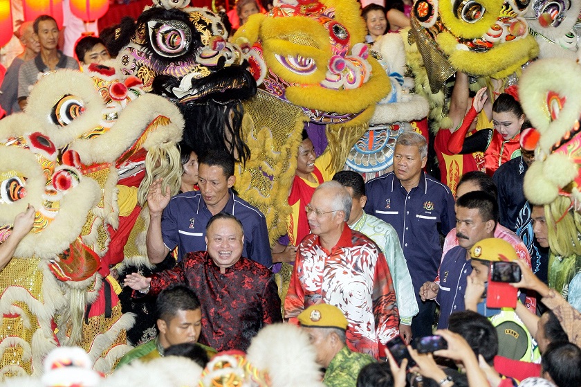 Prime Minister Datuk Seri Najib Razak is greeted by a team of Lion Dance performers as he attends a meet and greet session in conjunction with the Chinese New Year celebrations at Kuching. Picture released February 28, 2015. u00e2u20acu201d Bernama pic