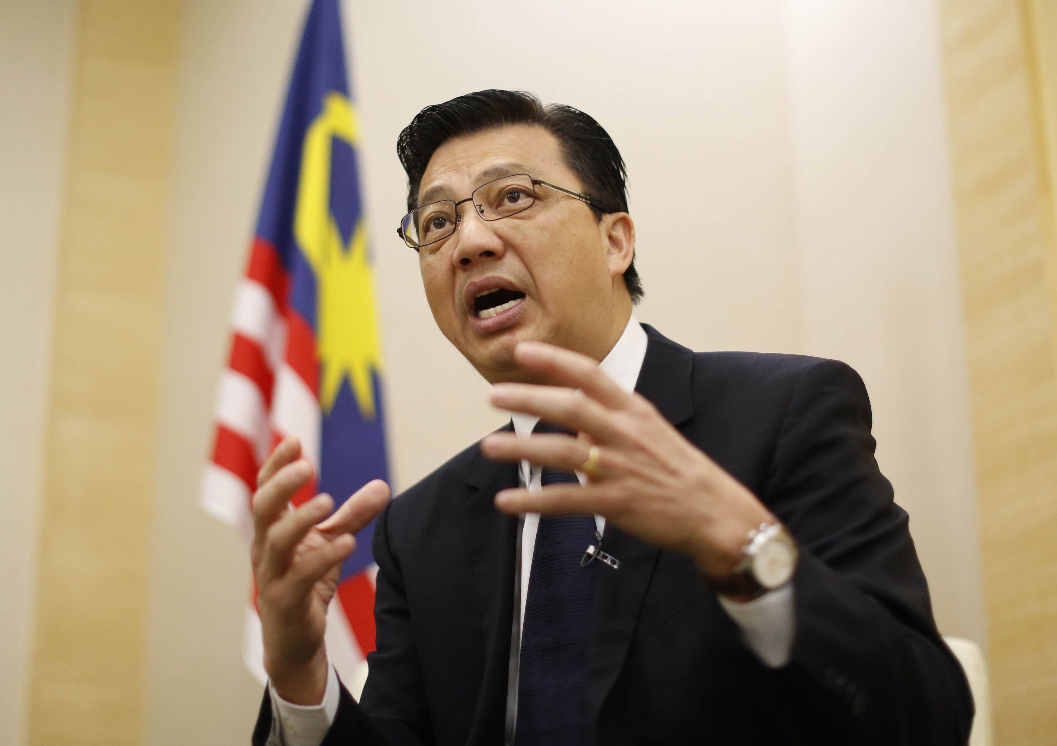 Datuk Sri Liow Tiong Lai gestures during an interview with Reuters ahead of the one-year anniversary of the disappearance of Malaysia Airlines flight MH370, in Putrajaya, March 6, 2015. u00e2u20acu201d Reuters picn