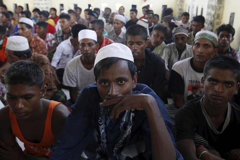 A group of Rohingya and Bangladeshi migrants, who arrived in Indonesia by boat this week, sit after arriving at a new shelter in Lhoksukon, Indonesiau00e2u20acu02dcs Aceh Province May 13, 2015. u00e2u20acu201d Reuters pic