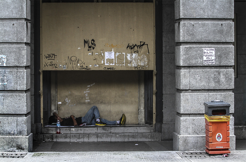 A homeless man is seen sleeping on the sidewalks along Jalan Tun Perak in Kuala Lumpur, May 5, 2015. u00e2u20acu201d Picture by Yusof Mat Isa