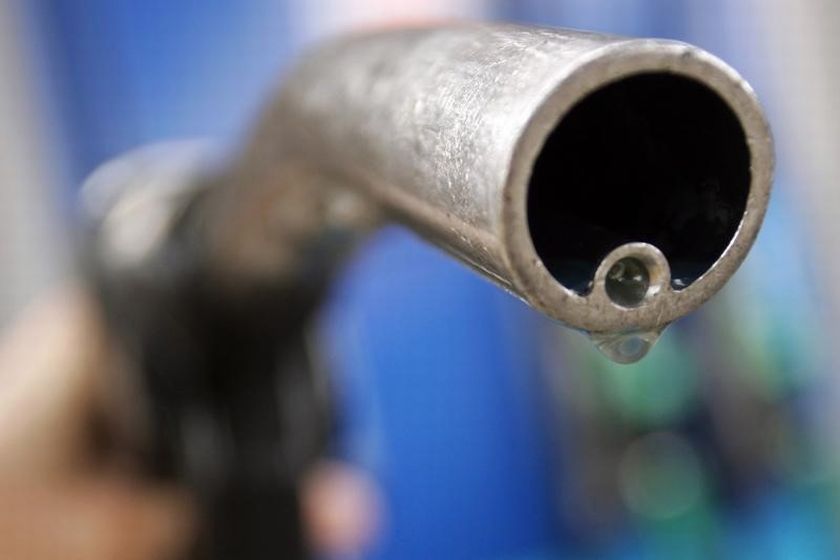 A motorist holds a fuel pump at a Gulf petrol station in London  in this April 18, 2006. u00e2u20acu201d Reuters pic