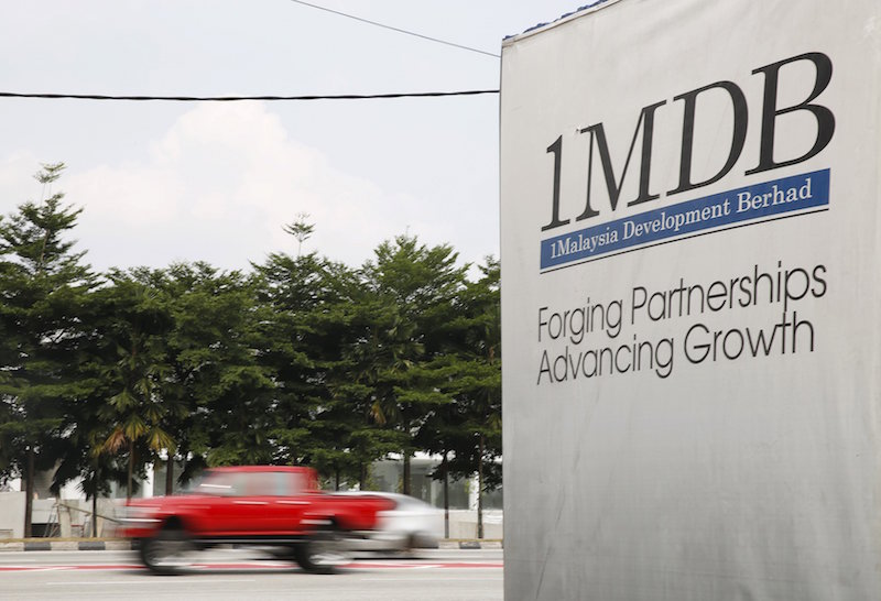 Traffic passes a 1Malaysia Development Berhad (1MDB) billboard at the Tun Razak Exchange development in Kuala Lumpur in this file picture taken July 6, 2015. u00e2u20acu201d Reuters pic