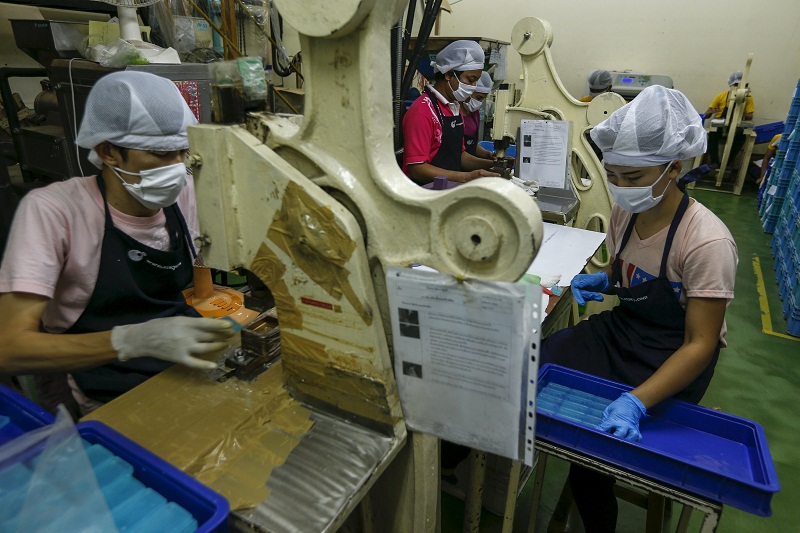Workers wrap soap bars at a STS Consumer Product factory in Bangkok, Thailand, March 28, 2016. u00e2u20acu201d Reuters pic