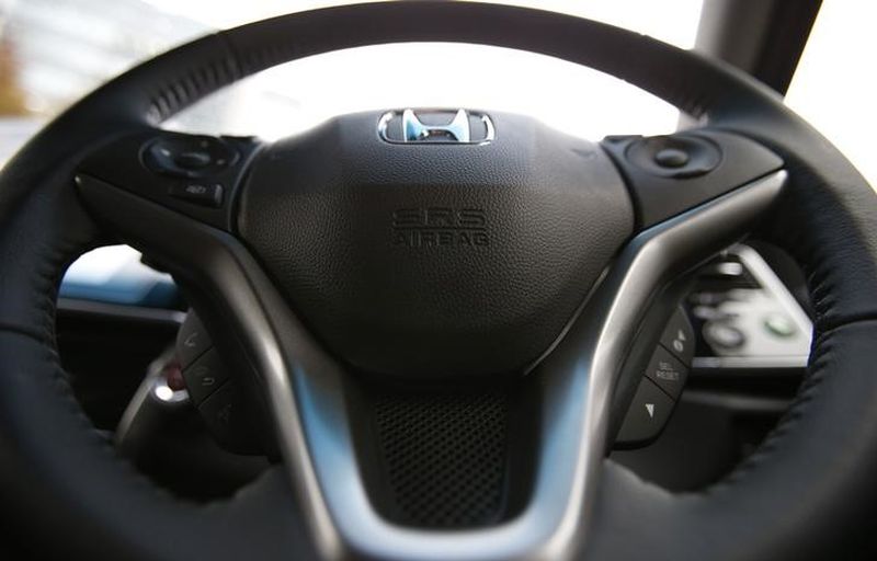 An airbag logo is seen on a steering wheel of Honda Motor Co's all-new hybrid sedan u00e2u20acu02dcGraceu00e2u20acu2122, which installed the airbag made by Takata Corp. u00e2u20acu2022 Reuters pic