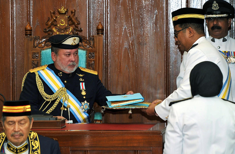 The Sultan of Johor Sultan Ibrahim Sultan Iskandar receiving the texts of his speech presented to him by Johor Menteri Besar Datuk Seri Mohamed Khaled Nordin during the opening of the Fourth Session of the 13th State Assembly in Johor Baru, April 14. u00e2u20acu201d 
