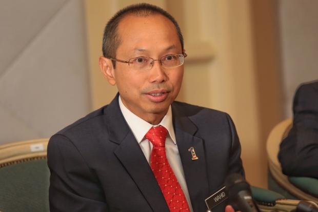 Tan Sri Abdul Wahid Omar revealed that he has driven commuters for ride-sharing app Uber for charity, and also to promote national carmaker Protonu00e2u20acu2122s new Perdana model. u00e2u20acu201d File pic