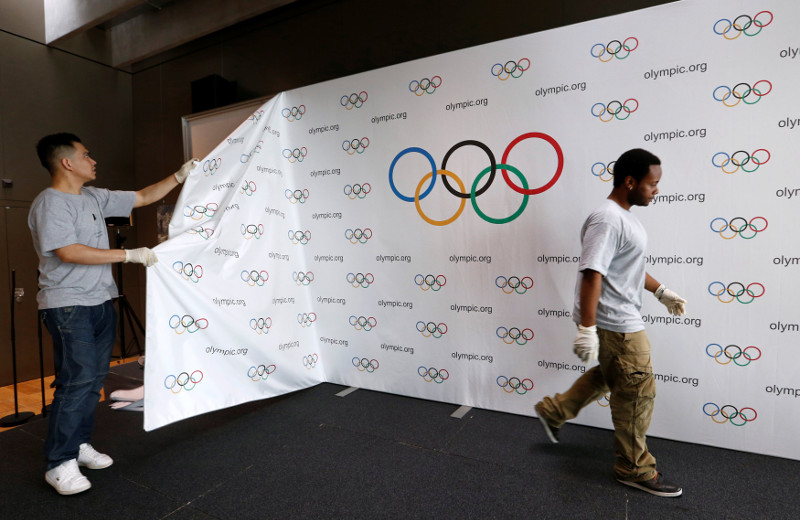 File picture shows staff of the International Olympic Committee (IOC) dismantling a backdrop after a news conference after the Olympic Summit on doping in Lausanne, Switzerland, June 21, 2016. u00e2u20acu201d Reuters pic