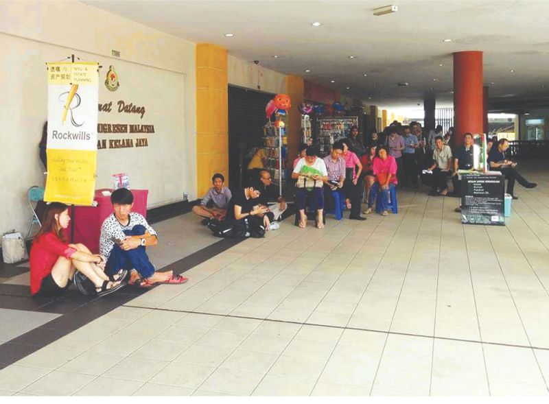 People waiting to renew their passports were forced to wait outside the Immigration Department office at Plaza Glomac. Many immigration department branches nationwide face a shortage of passports, forcing them to turn away applicants. u00e2u20acu201d Picture from Fac