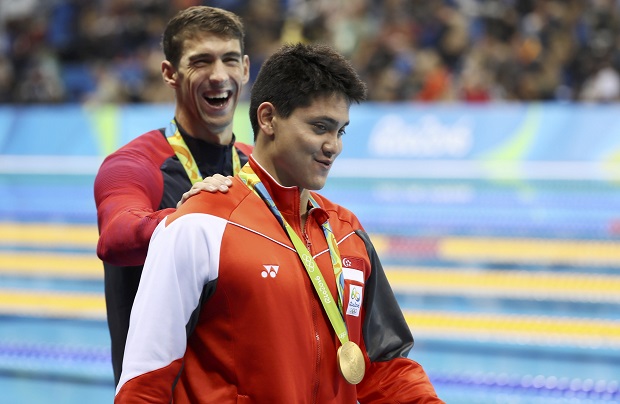 Joseph Schooling of Singapore is congratulated by Michael Phelps of USA as they leave the podium at the Olympic Aquatics Stadium in Rio de Janeiro, August 13, 2016. u00e2u20acu201d Reuters pic