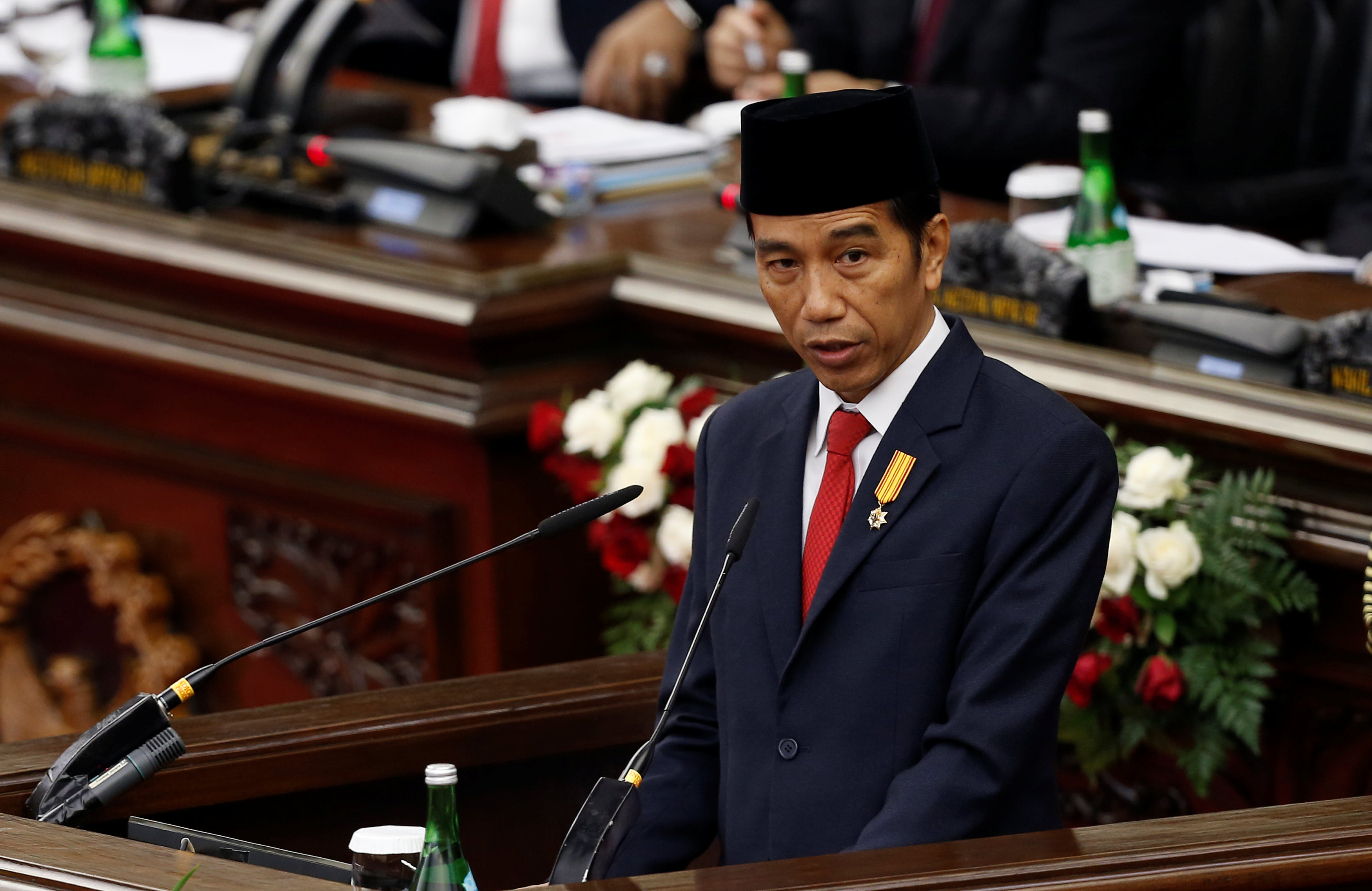 Indonesia's President Joko Widodo delivers a speech in front of parliament members at the House of Representative building in Jakarta, Indonesia, August 16, 2016. 