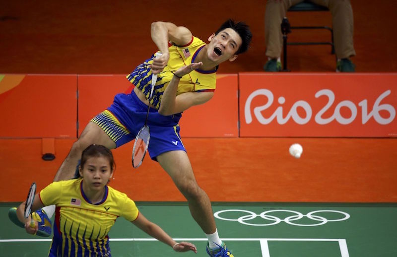 Chan Peng Soon and Goh Liu Ying of Malaysia play against Bodin Isara and Savitree Amitrapai of Thailand in the badminton mixed doubles group play in Rio de Janeiro August 11, 2016. u00e2u20acu201d Reuters pic