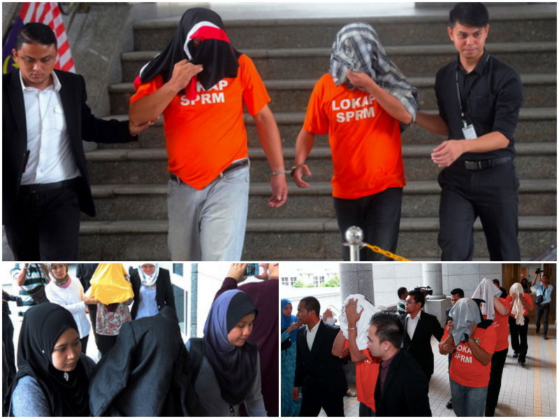 PUTRAJAYA, 26 Ogos -- Pegawai Suruhanjaya Pencegahan Rasuah Malaysia (SPRM) mengiringi dua antara empat suspek yang ditahan termasuk seorang pengarah urusan sebuah bank bergelar Datuk ke Mahkamah Majistret hari ini bagi memohon perintah reman terhadap mer