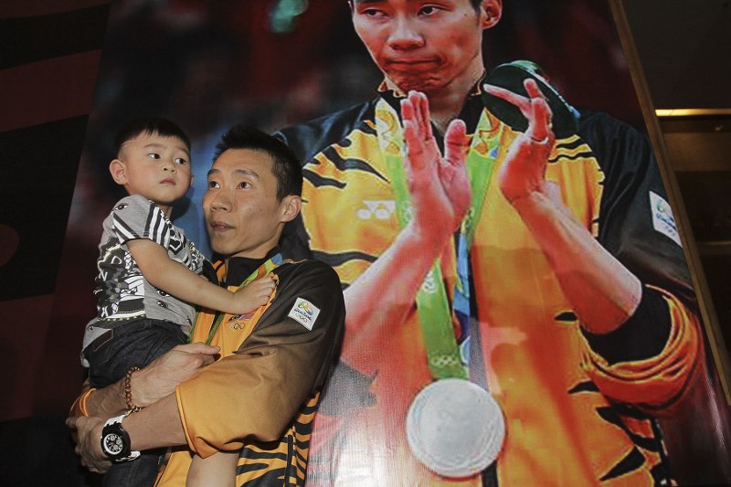 Datuk Lee Chong Wei poses for pictures with his son at KLIA after he returned with the rest of the Malaysian contingent from the 2016 Rio Olympics August 24, 2016. u00e2u20acu201d Picture by Yusof Mat Isa