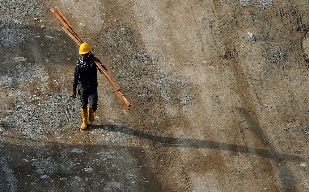 A worker walks at the construction site where locally transmitted Zika cases were first discovered in Singapore August 31, 2016. REUTERS/Edgar Su