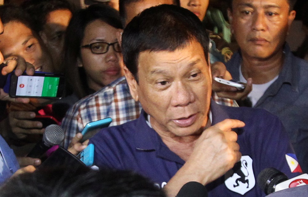 Philippines President Rodrigo Duterte is interviewed by reporters after visiting the explosion site at a market in Davao City, Philippines September 3, 2016. REUTERS/Lean Daval Jr TPX IMAGES OF THE DAY