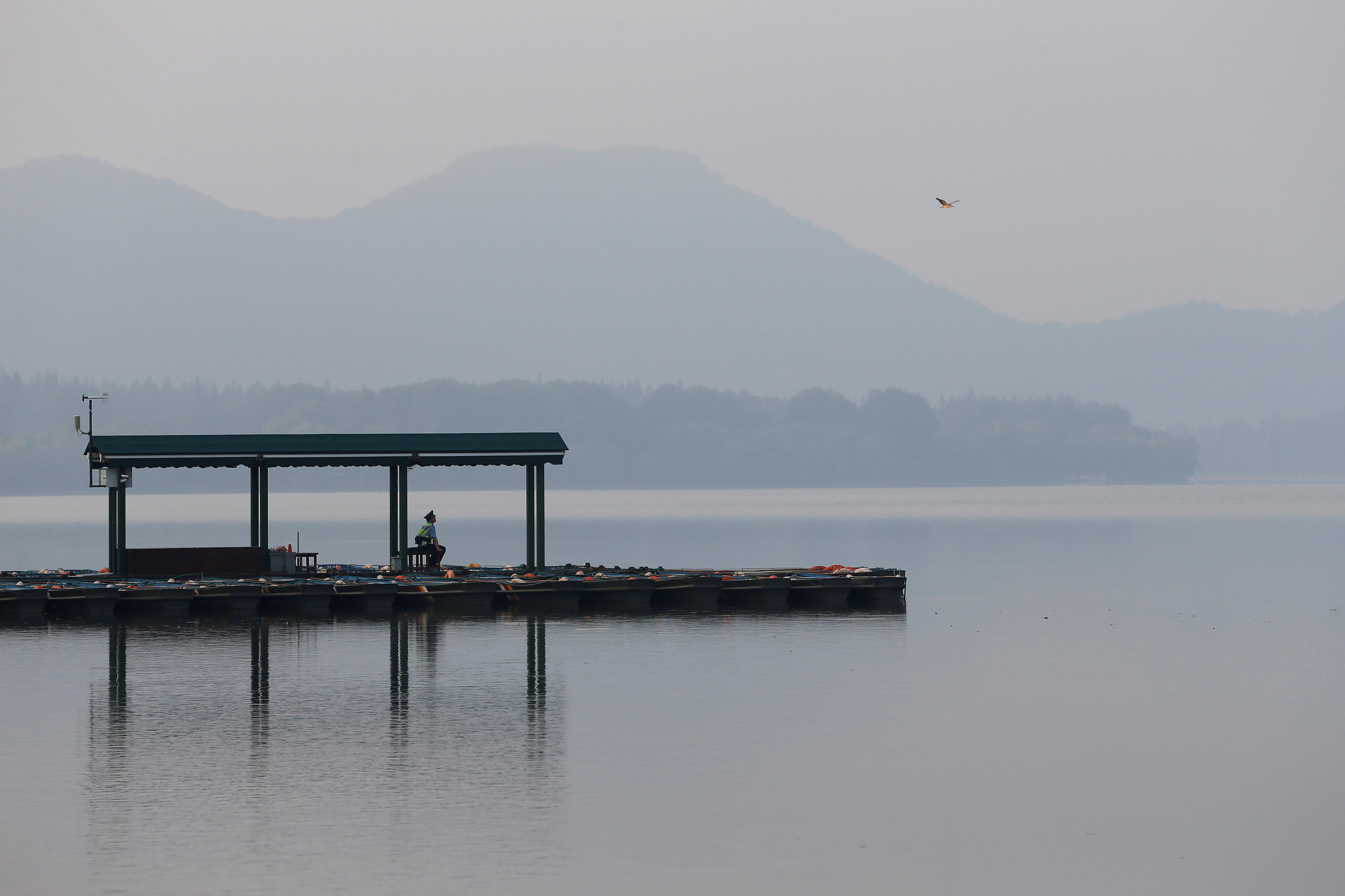 Security personnel keep watch, as they close the West Lake before the G20 Summit in Hangzhou, Zhejiang province, China September 3, 2016. REUTERS/Aly Song TPX IMAGES OF THE DAYn
