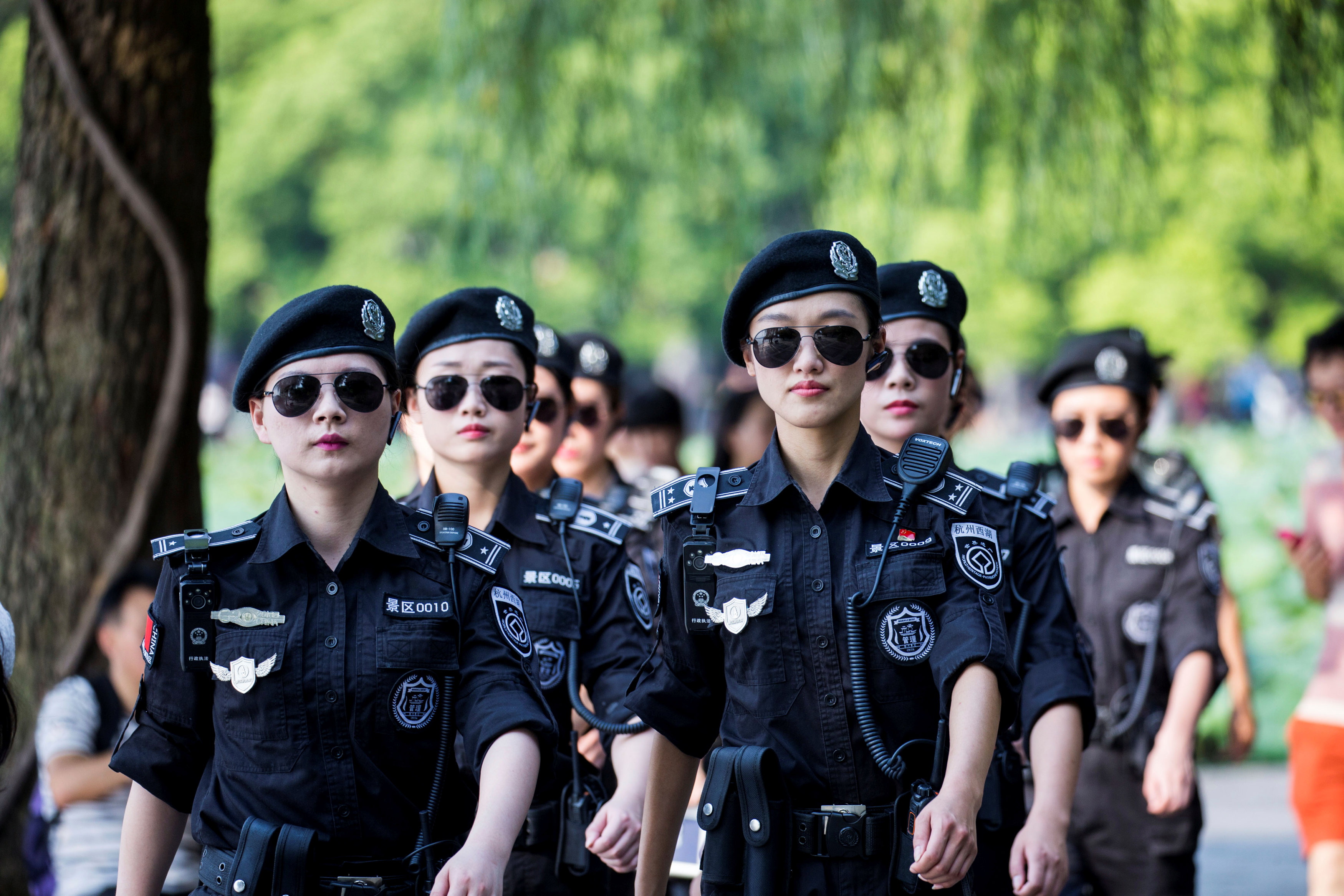 Security personnel patrol around West Lake in Hangzhou, Zhejiang Province, China, August 31, 2016. Picture taken August 31, 2016. REUTERS/Stringer ATTENTION EDITORS - THIS IMAGE WAS PROVIDED BY A THIRD PARTY. EDITORIAL USE ONLY. CHINA OUT. NO COMMERCIAL O
