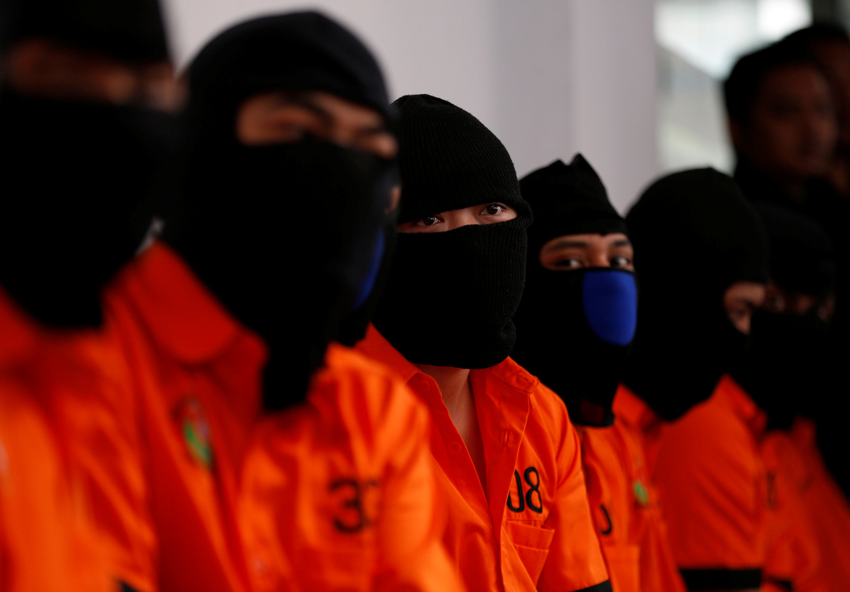 Recently arrested drug trafficking suspects, including foreigners, wait for the start of an illegal narcotics destruction event at police headquarters in Jakarta, Indonesia July 21, 2016. Picture taken July 21, 2016. REUTERS/Darren Whitesiden