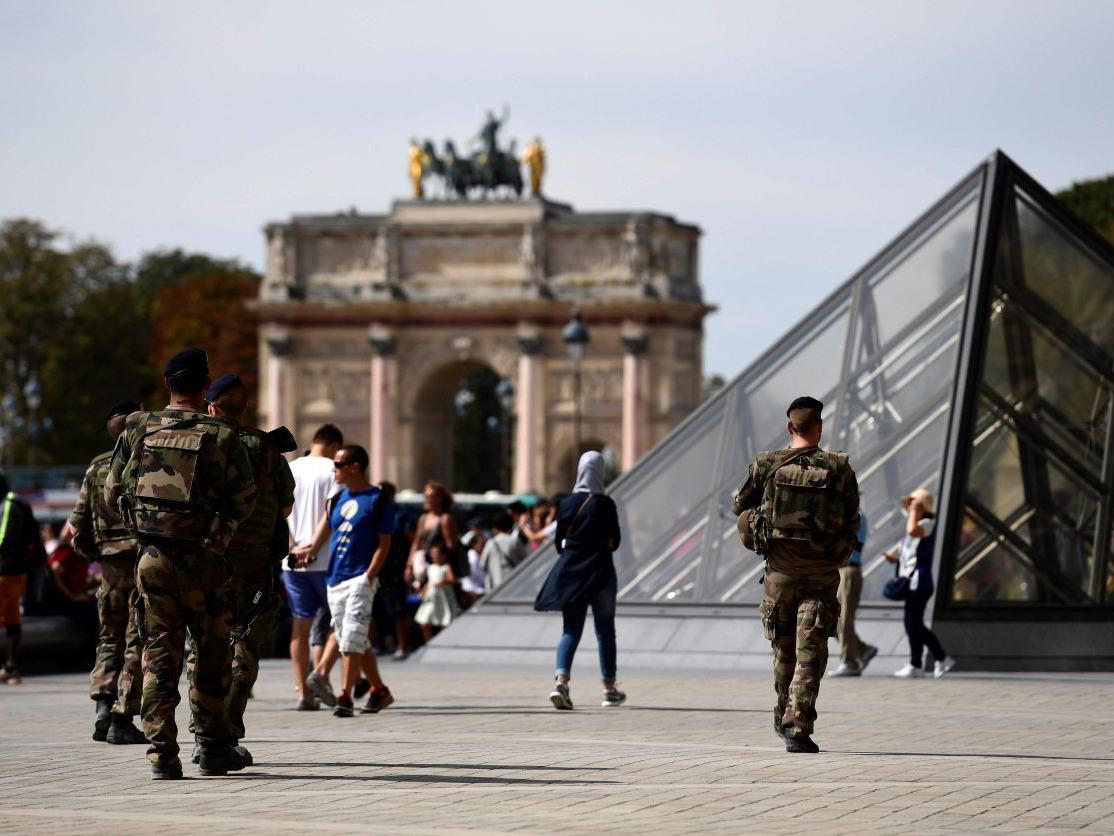 Soldiers patrol around the Louvre Museum in Paris.-pic via AFP-