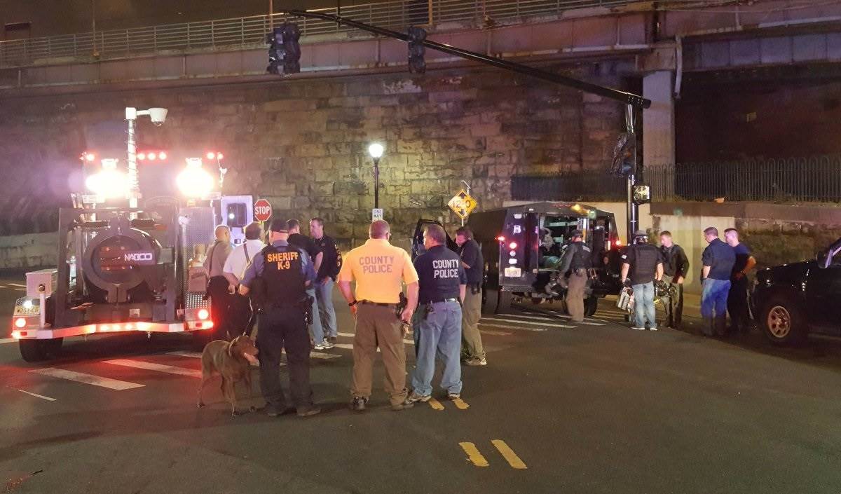 An FBI bomb squad investigates a suspicious device Sunday night at the train station in Elizabeth, N.J.-pic via NBC-n