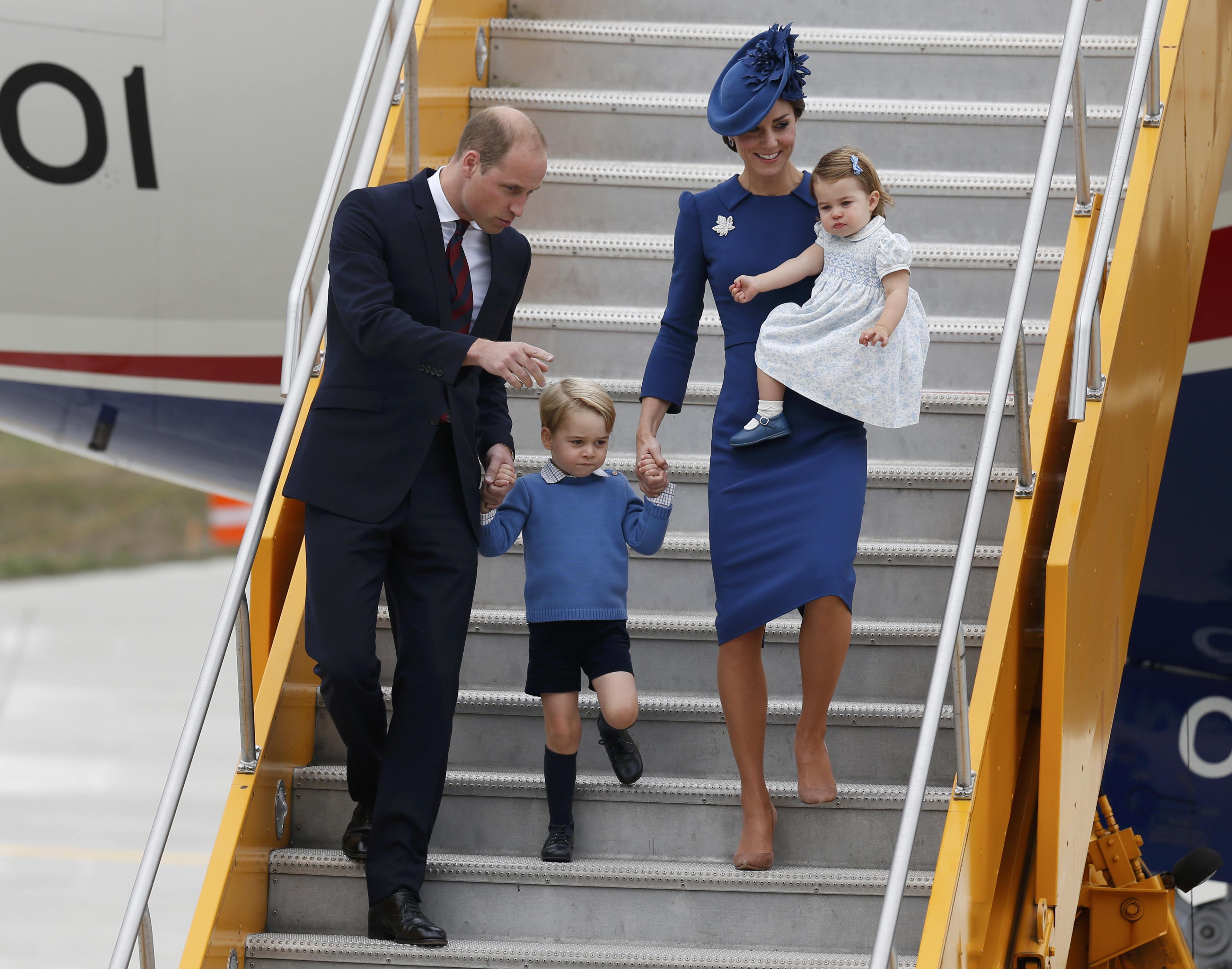 Britain's Prince William (L), Catherine, Duchess of Cambridge, Prince George (2nd L) and Princess Charlotte arrive at the Victoria International Airport for the start of their eight day royal tour to Canada in Victoria, British Columbia, Canada, September