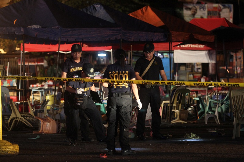 Police investigators inspect the area of a market where an explosion happened in Davao City, Philippines September 2, 2016. u00e2u20acu201d Reuters pic