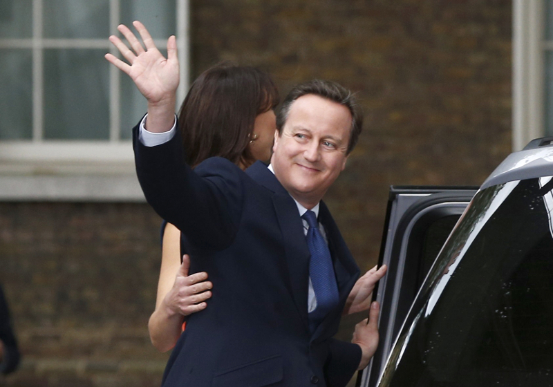 Britainu00e2u20acu2122s outgoing Prime Minister, David Cameron with his wife Samantha, waves in front of number 10 Downing Street, on his last day in office as Prime Minister, in central London, Britain July 13, 2016. u00e2u20acu201d Reuters pic