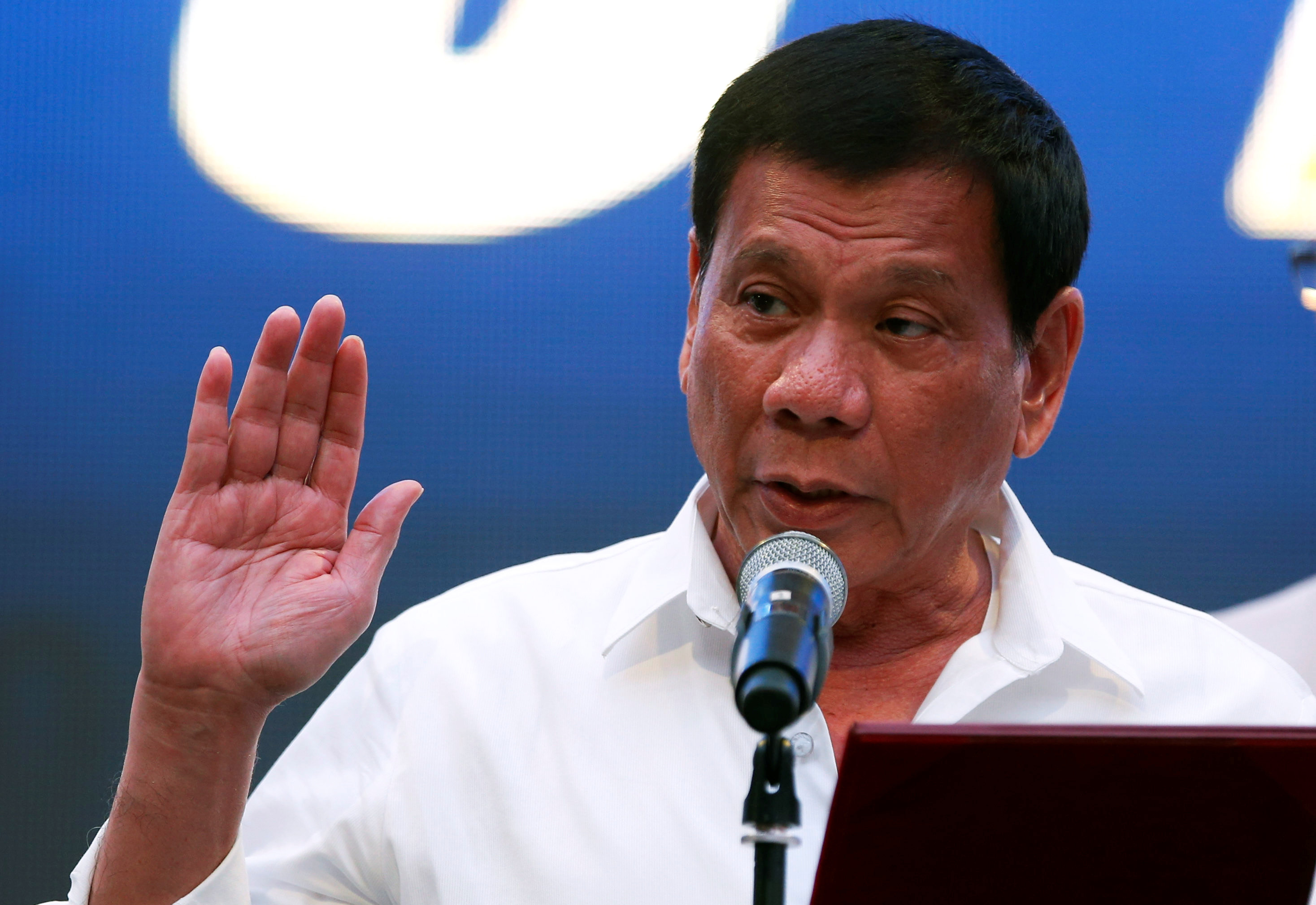 President Rodrigo Duterte inducts new officers of a business group during a meeting in Pasay city, Metro Manila, Philippines, October 13, 2016. REUTERS/Erik De Castron