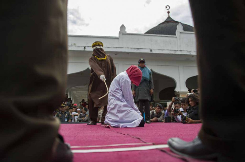 File picture shows an Acehnese woman convicted of u00e2u20acu02dcimmoral actsu00e2u20acu2122 being caned in public in Banda Aceh on June 12, 2015. u00e2u20acu201d AFP file pic