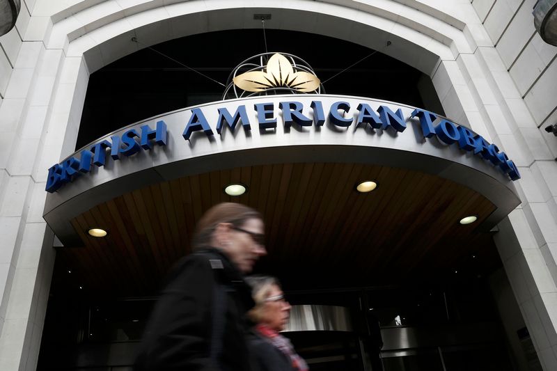 People walk past the British American Tobacco offices in London October 21, 2016. u00e2u20acu201d Reuters pic