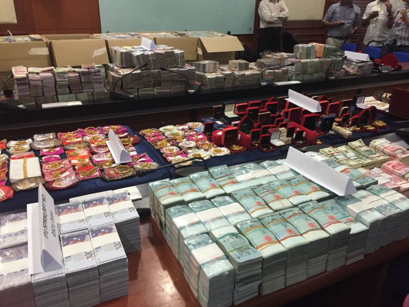 An array of cash both ringgit and foreign currency, gold jewellery, land titles and luxury brand watches and handbags were seized from two high ranking Sabah state agency officials in a graft investigation. u00e2u20acu2022 Picture by Julia Chan